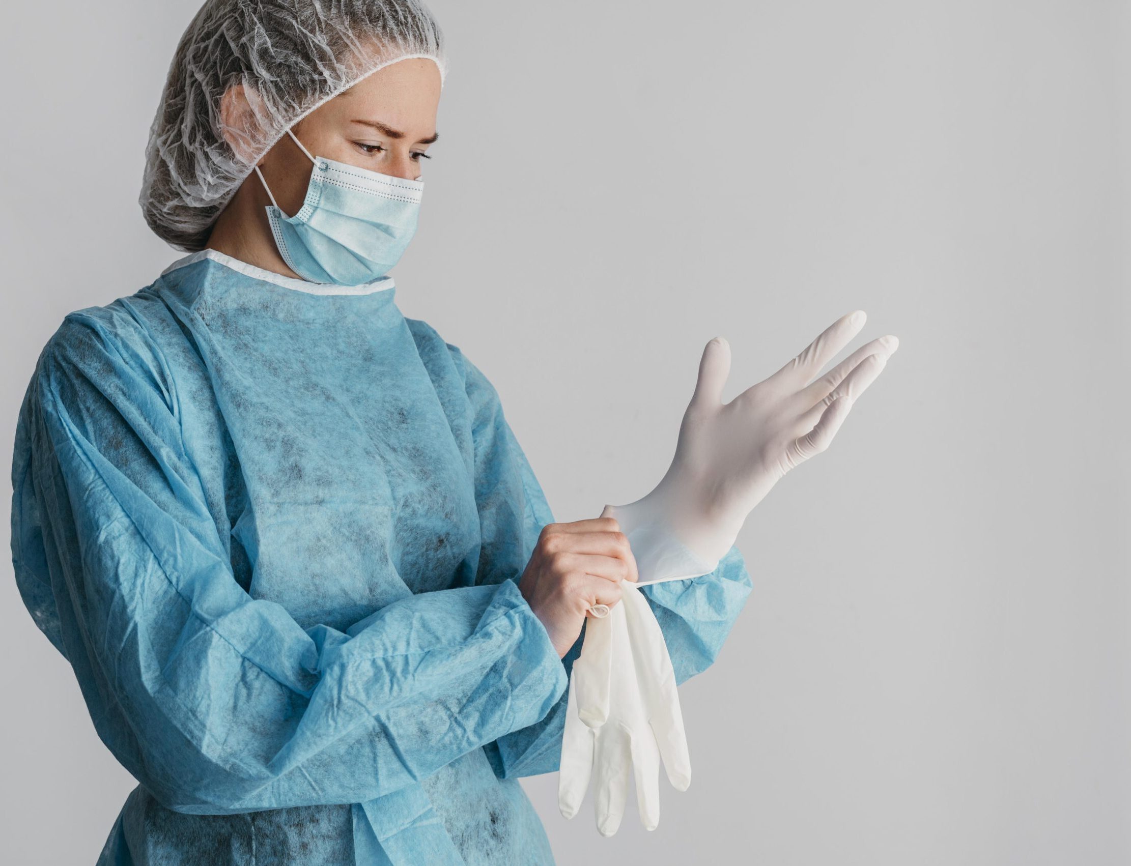 doctor-putting-surgical-gloves